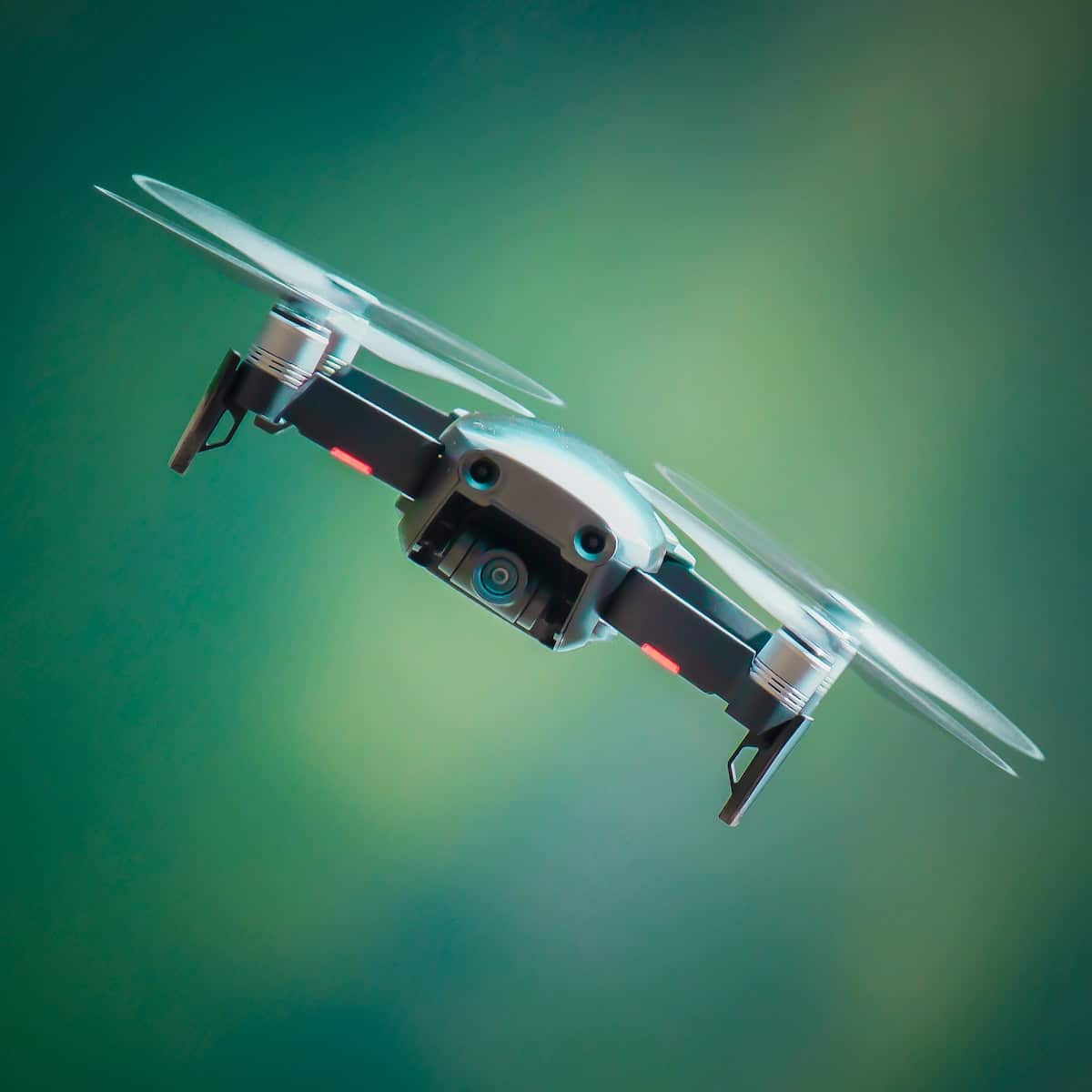 selective focus photography of gray and black quadcopter drone